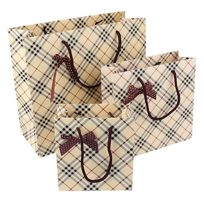 Niestandardowe drukowane biodegradowalne torby papierowe hurtowo z kokardką